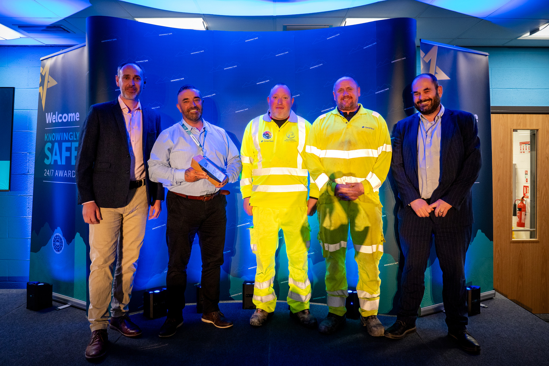 The Severfield PPI Improvements team with their award, flanked by James Lewis, head of EHSSQ, left, and delivery director Steve Harnwell, right.